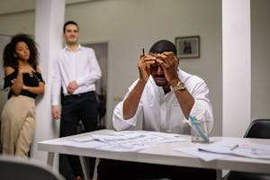 Adult struggling with focus showing common signs of adult ADHD