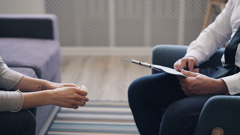 Maryland psychiatrist meeting with a patient to discuss whether psychiatrists do therapy