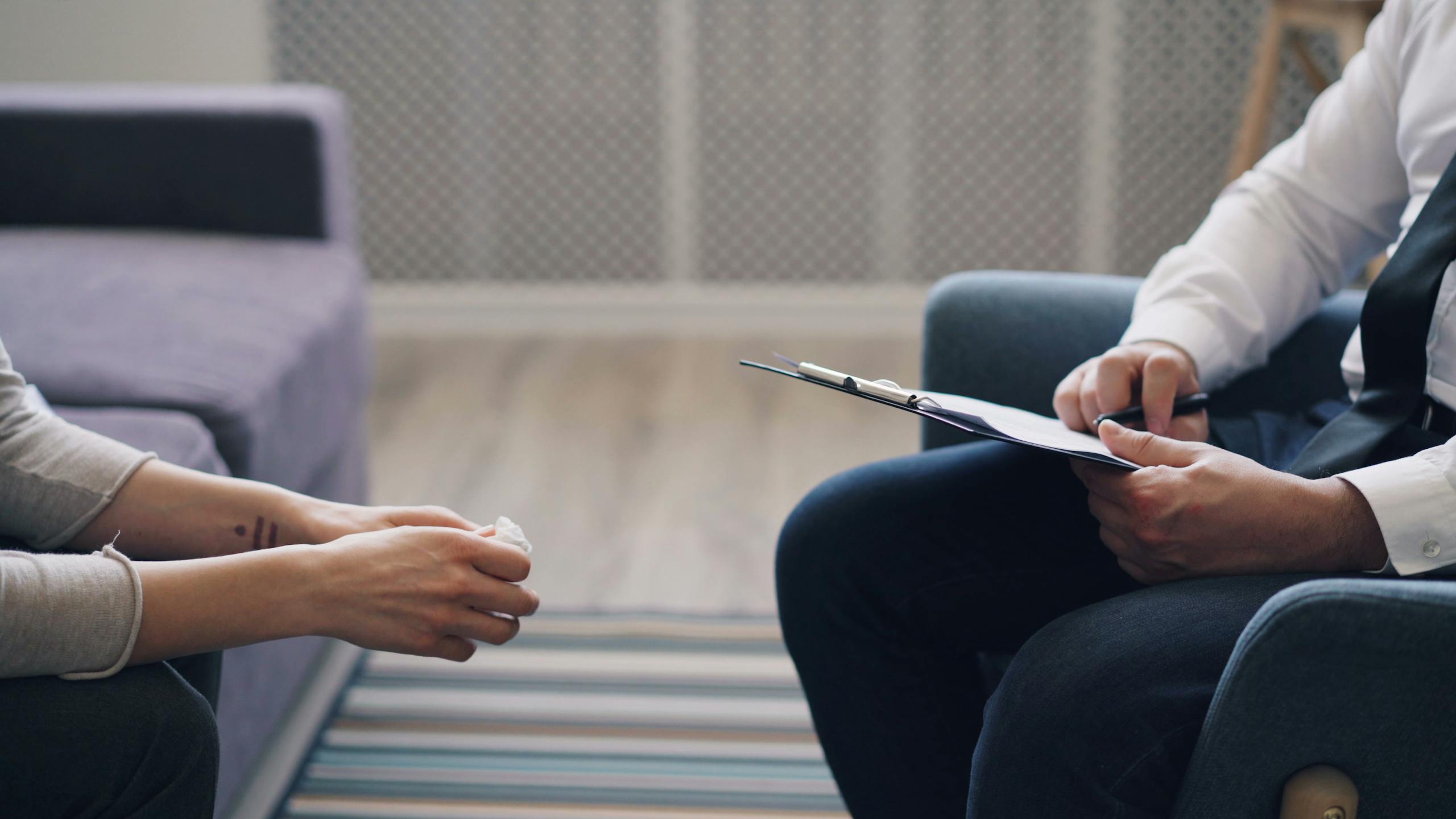 Maryland psychiatrist meeting with a patient to discuss whether psychiatrists do therapy