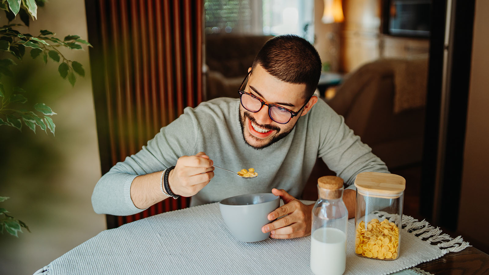 Man eating breakfast at home, appetite returning during depression recovery is often mistaken for medication weight gain