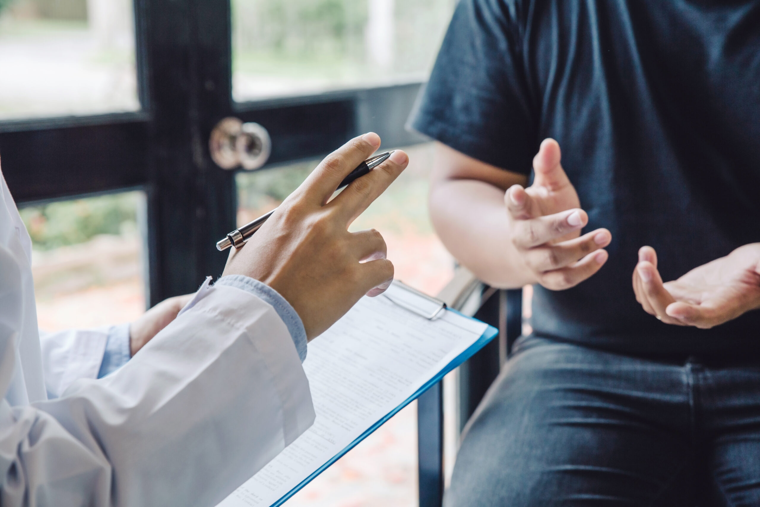 Adult discussing bipolar depression treatment options with a psychiatrist