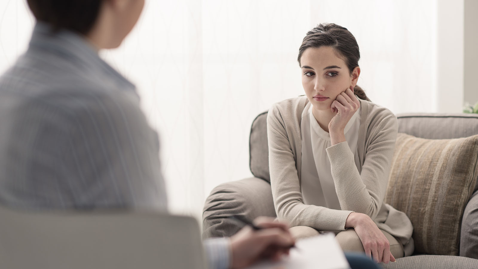 Adult patient in consultation discussing OCD treatment options before starting a course of Deep TMS