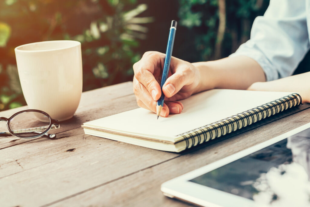 Hand writing a short list to find a psychiatrist in Montgomery County Maryland